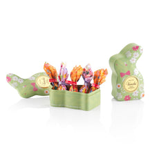 Open Venchi green bunny tin with chocolates inside