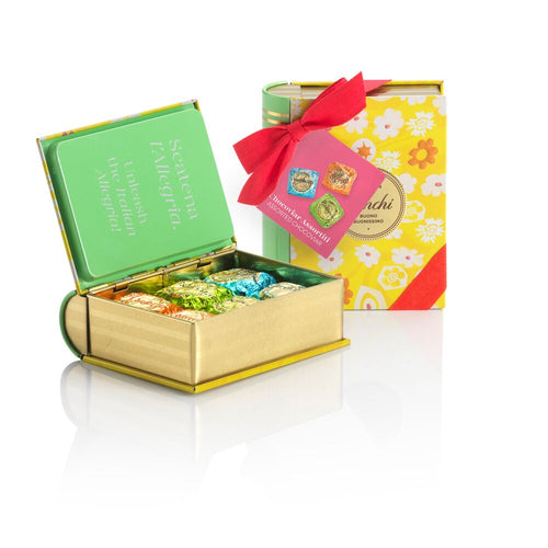 Venchi Easter Spring mini book tin with its lid open and foil-wrapped chocolates