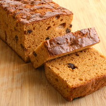 Slices of Honey Spice Cake with Figs on a wood cutting board