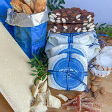 Panforte with Parmigiano-Reggiano cheese, ricciarelli cookies, biscotti and candied orange peels